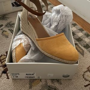 yellow and tan sandals